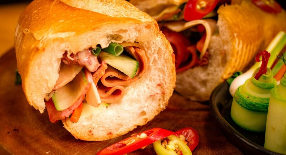 Close-up of a traditional Vietnamese bánh mì sandwich with fresh vegetables. Perfect for food lovers.